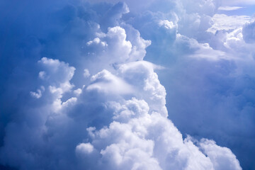 Wall Mural - Clouds view from the plane. Clouds are moving on camera. Flying through the cloud. Travel by air. Background