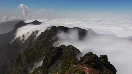 Wall Mural - Time lapse over clouds inversion event while hiking in Pico Ruivo mountain trail in Madeira, Portugal