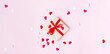 holiday background valentine's day. composition with gift, ribbons, confetti hearts on a pink background. copy space top view. flat lay. concept for February 14