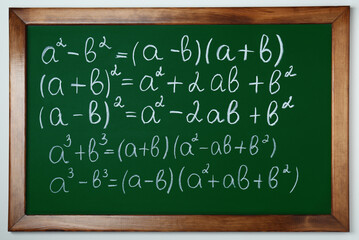 Wall Mural - Chalkboard with many different math formulas on white wall