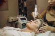 © Roman - Close-up of woman getting facial hydro microdermabrasion peeling treatment. Female at cosmetic beauty spa slinic. Hydra vacuum cleaner. Cosmetology