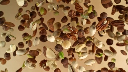 Poster - Super slow motion of rotating mix nuts up to the air. Filmed on high speed cinema camera, 1000fps, placed on high speed cine bot. Speed ramp effect.