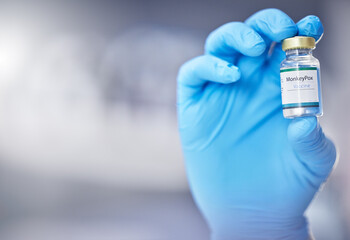Poster - Innovation, healthcare or hand with vaccine, medicine or product in bottle with a blurry or blurred background. Monkey pox, doctor or scientist working on medical cure or lab drugs in safety gloves