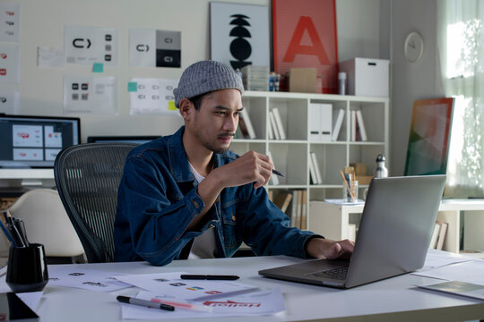 Asian man Graphic designer working in office. Artist Creative Designer Illustrator Graphic Skill Concept.
