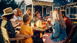 © Gorodenkoff - Parents, Children and Friends Gathered at a Barbecue Dinner Table Outside a Beautiful Home. Old and Young People Have Fun, Eat and Drink. Garden Party Celebration in a Backyard.