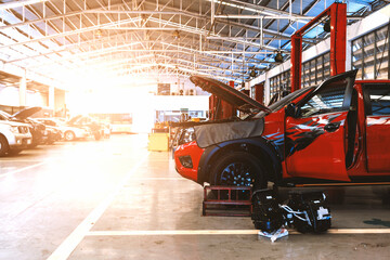 Wall Mural - car in automobile repair service center with soft-focus and over light in the background