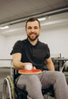 © Roman - A man in a wheelchair plays table tennis