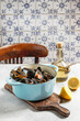 © The Picture Pantry - mussels in white wine and lemon juice in a blue cast-iron caseroll
