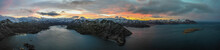 Panoramic Aerial View Of A Mountain Range With Snow On The Crests Along The Dutch Harbour On Amaknak Island At Sunset, Unalaska, Alaska, United States.