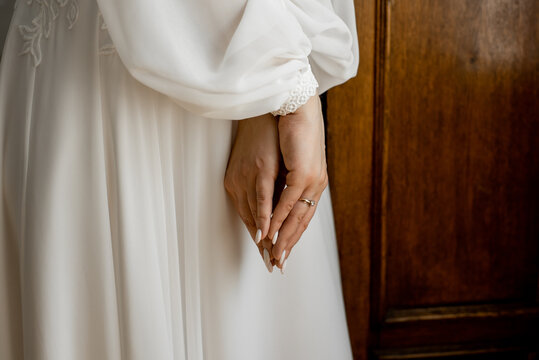 female hands with wedding ring
