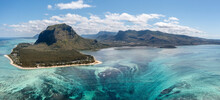Panoramic Aerial View Of Le Morne Mountain In Early Morning With Reef And Mountain Range In The Background, Le Morne Brabant, Mauritius.