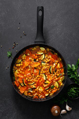 Wall Mural - Chickpea and zucchini saute with carrot and garlic. Classic italian side dish. Top view
