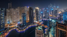 View Of Various Skyscrapers In Tallest Recidential Block In Dubai Marina Aerial Night Timelapse