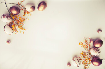 easter  holidays background with  golden eggs over white table