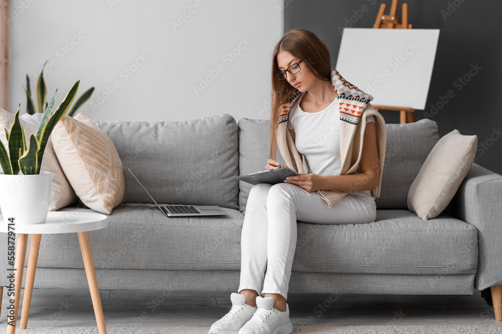 Female psychologist video chatting with patient at home