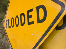 Signage Warning Of A Flooded Road In Los Osos, California.