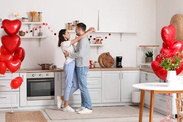 Canvas Print - Happy couple dancing in kitchen on Valentine's Day