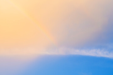 Wall Mural - clear sky rainbow background fluffy white clouds