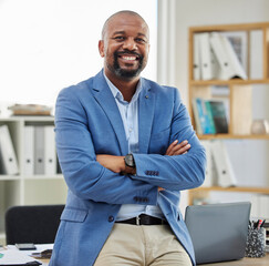 Accountant portrait and corporate black man in office with confidence, pride and smile in workspace. Mature employee in professional accounting company with arms crossed and optimistic mindset.