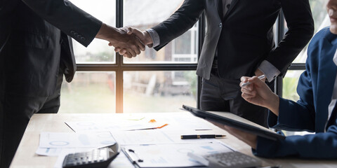 Business handshake for teamwork of business merger and acquisition,successful negotiate,hand shake,two businessman shake hand with partner to celebration partnership and business deal concept