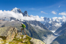 A Male Runner Is Sprinting Up A Steep Trail In The Mountains Of Outdoor Paradise Chamonix In The French Alps.
