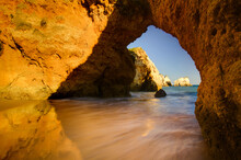 View To The Arches At Marinha Beach In Lagoa, Alvor, Portimao, Algarve, Portugal.