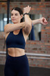 © Kirsti D/peopleimages.com - Fitness, exercise or woman stretching at gym for flexible arms in body warm up exercise, training or workout. Wellness, relax or healthy girl athlete exercising for body goals, sports or self care