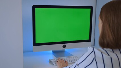 Aufkleber - employee working in office using computer with green screen workplace at home or office