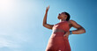 © C Malambo/peopleimages.com - Fitness, blue sky and mockup with a sports black woman blocking the sun while running outdoor for cardio. Workout, wellness and health with a female runner or athlete covering her face from sunlight