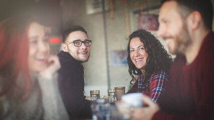 Young couple drink coffee in the cafe and enjoying