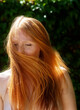 © ullision - Sensual sexy portrait of young beautiful naked redhead woman shakes her flying red hair outdoors in the sunlight