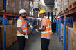 © Tongpool - Worker in depot storage warehouse use tablet pc check scan barcode goods box and store on shelf