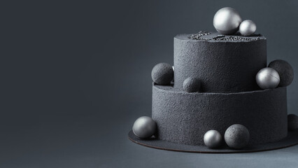 Canvas Print - Anniversary luxury black bunk cake with chocolate velvet coating on dark grey background. Birthday cake with black velvet texture decorated with silver chocolate spheres