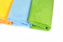 Stack Of Color Microfiber Cloths Isolated On White. Row Of Colorful Microfiber Towels.
