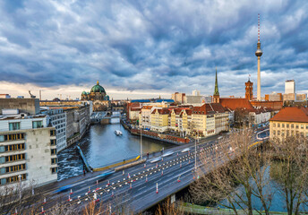 Poster - Aerial shot of Berlin Cathedral, Spree canal and historic buildings during a dramatic sky cloud, Germany