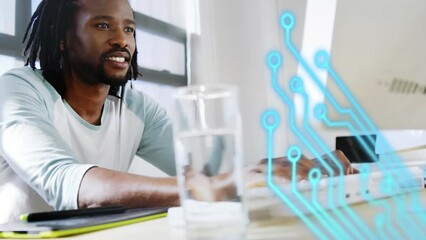 Poster - Animation of microprocessor connections over african american man using computer at office
