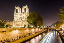 Notre-Dame Cathedral And Seine River At Night, Paris, France