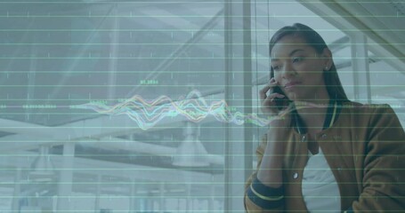 Poster - Animation of multicolored graphs, numbers, biracial woman talking on cellphone in corridor of office