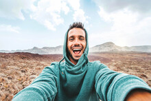 Handsome Man Taking Selfie Photo With Smart Mobile Phone Device Outside - Cheerful Climber Hiking Mountains - Travel Blogger, People And Action Camera Concept