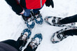 person going for a hike with snowshoes in winter