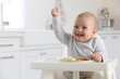© New Africa - Cute little baby eating healthy food at home. Space for text