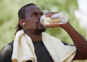 Poster - Water, fitness break and black man running in nature, exercise hydration and focus on body performance in Germany. Thirsty, training and African runner thinking of cardio workout in park with a drink