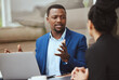 © S Fanti/peopleimages.com - Laptop, meeting and financial advisor with a business black man and woman client talking portfolio growth. Computer, finance and accounting with a male and female employee working on investment