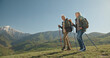 © andreybiling - Mature caucasian couple on vacation, having a hike in spring mountains, spending time together after retirement together travelling - tourism, pension concept