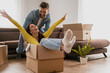 © ivanko80 - Happy couple is having fun with cardboard boxes