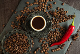 Fototapeta Paryż - traditional turkish coffee in vintage cup, roasted beans with hot spicy chili pepper on brown background 3