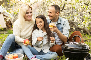 Canvas Print - Family having a barbecue in their garden