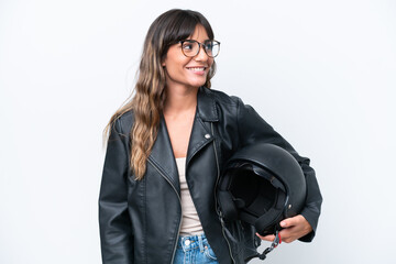 Wall Mural - Young caucasian woman with a motorcycle helmet isolated on white background looking side