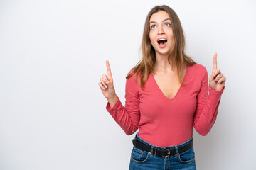 Young caucasian woman isolated on white background surprised and pointing up