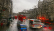 © Cavan Images - The glow of traffic lights in the rain in London, England